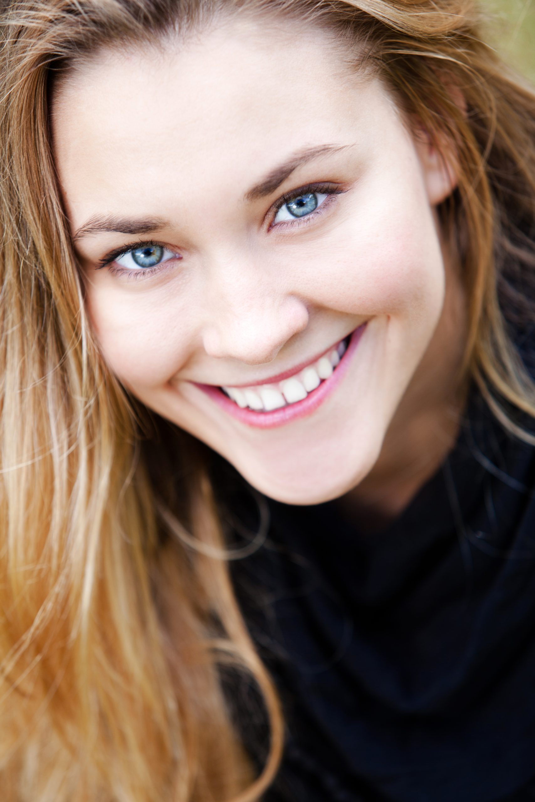 Young smiling girl with blue eyes